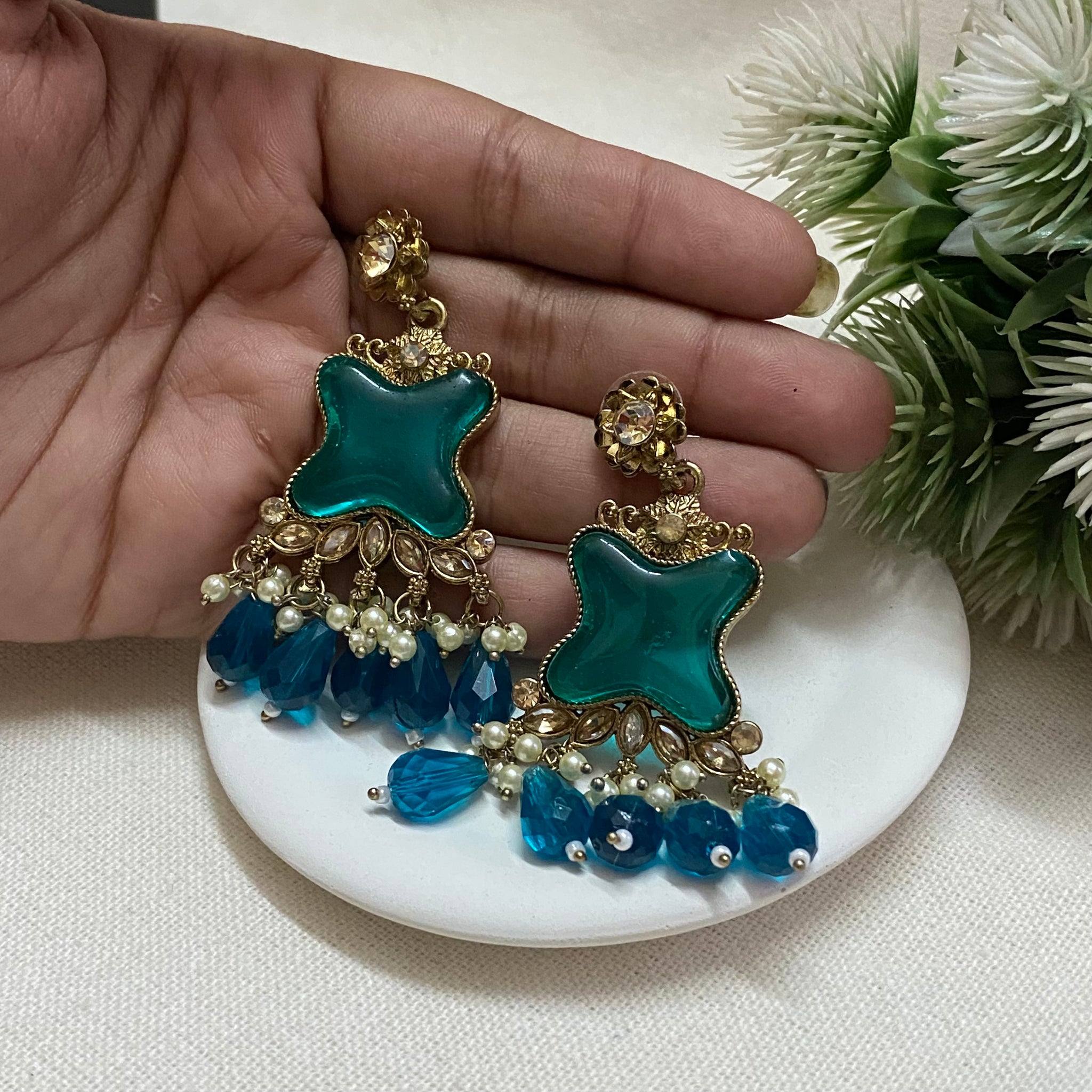 Golden heavy jhumka with mix of green and blue