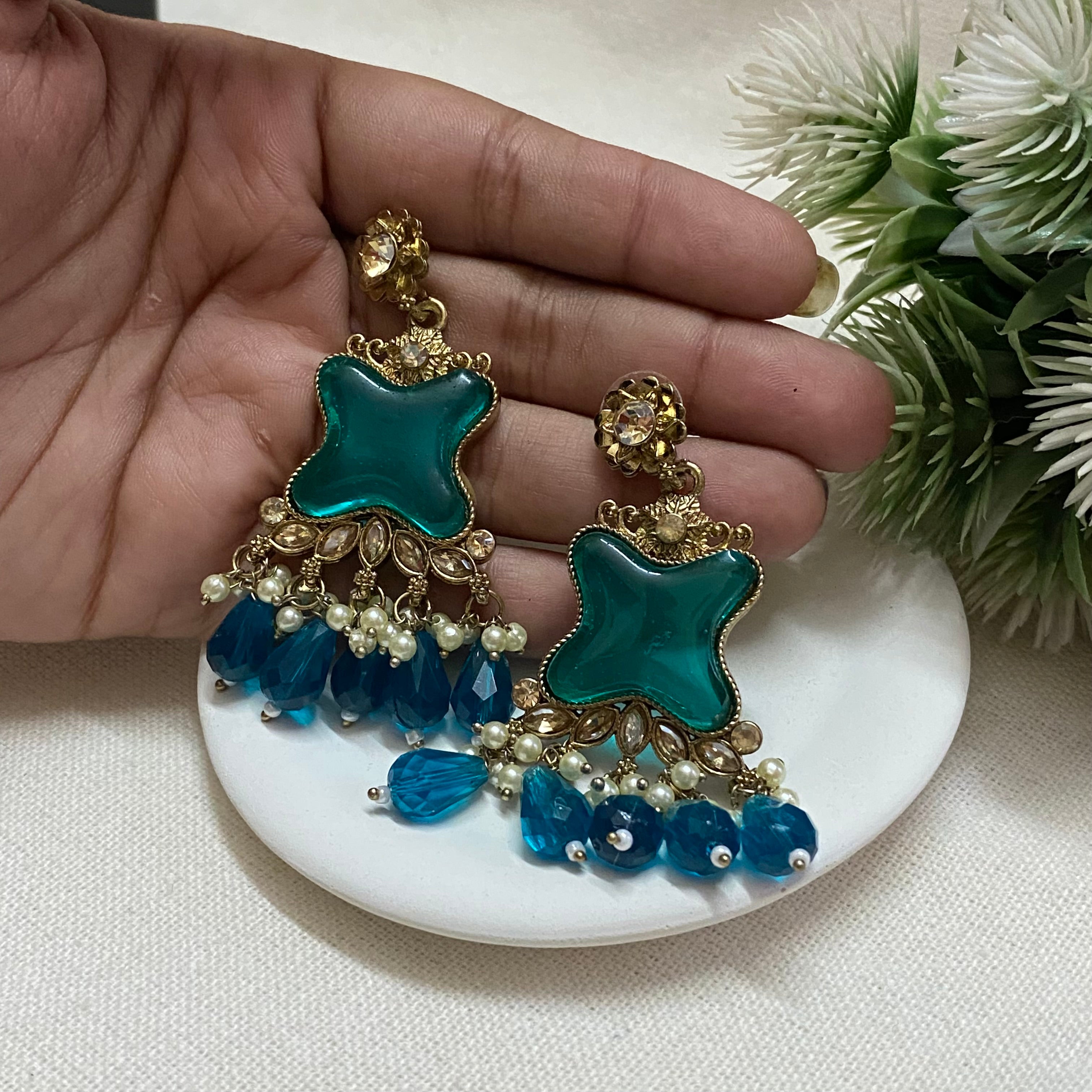 Golden heavy jhumka with mix of green and blue