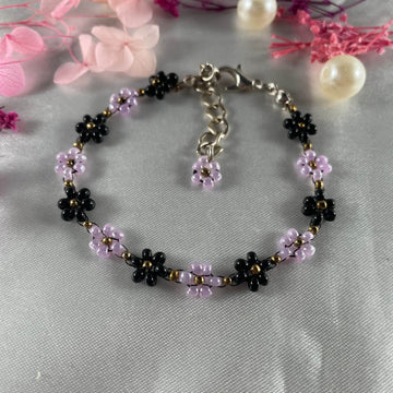 Daisy Flowers bracelet, made with Pastel purple and Black Colour, Golden bead finishing - Fatatun