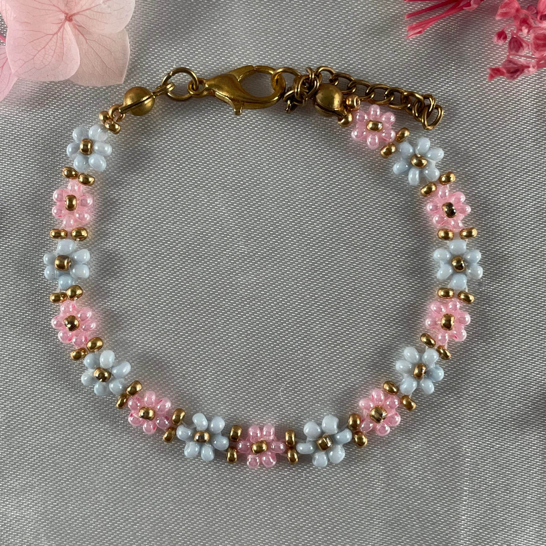 Daisy Flowers bracelet, made with Rose Pink and pastel blue Colour, Golden bead finishing - Fatatun