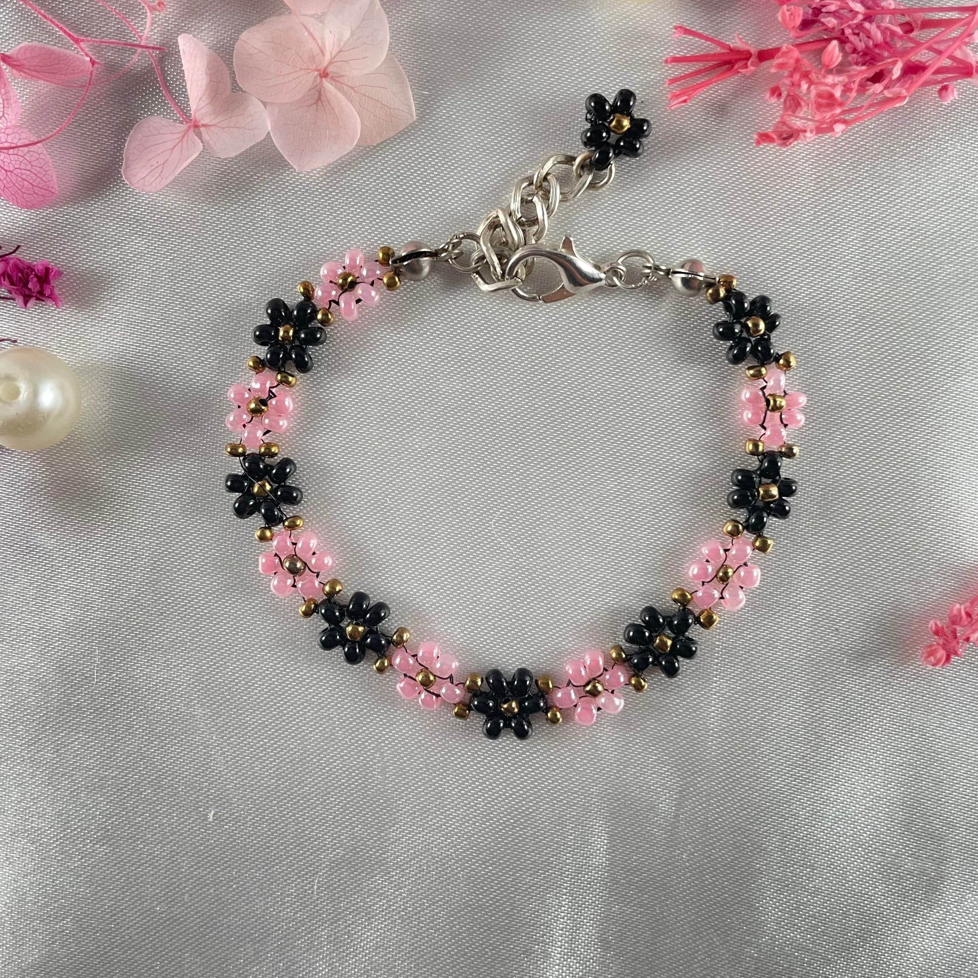 Daisy Flowers bracelet, made with rose Pink, and black Colour, Golden bead finishing - Fatatun
