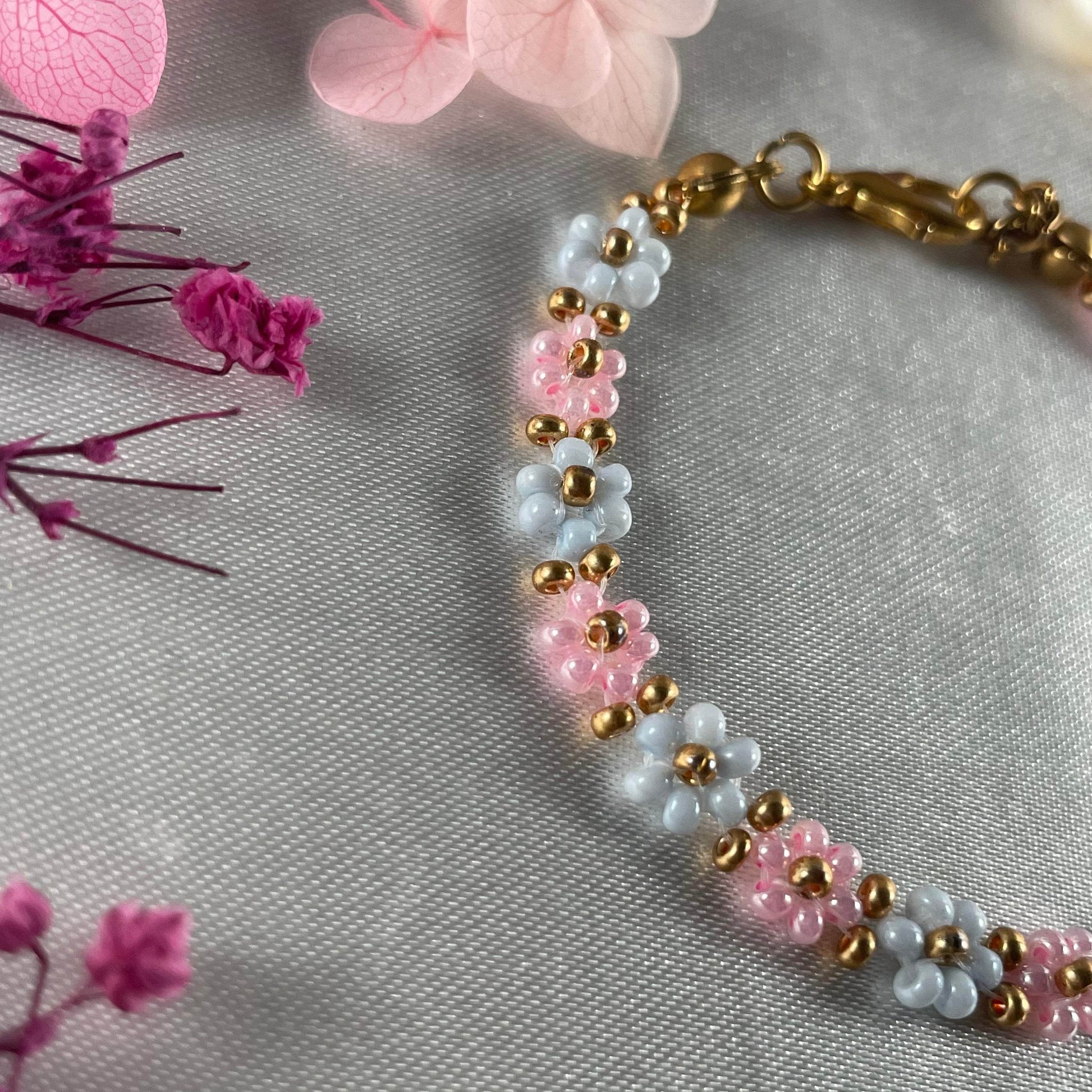 Daisy Flowers bracelet, made with Rose Pink and pastel blue Colour, Golden bead finishing - Fatatun