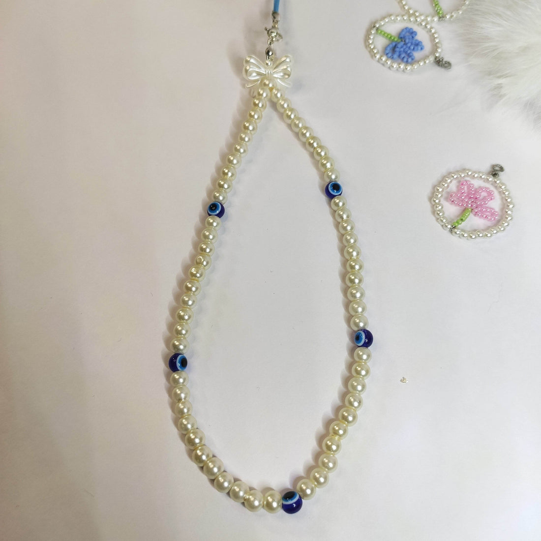 Phone accessories| pearl with Evil eye beads - Fatatun